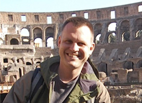 portrait of presenter Nicholas Gressens with Rome coliseum in the background
