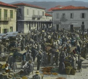 wide image of vegetable and fruit vendors in Kalamata town square